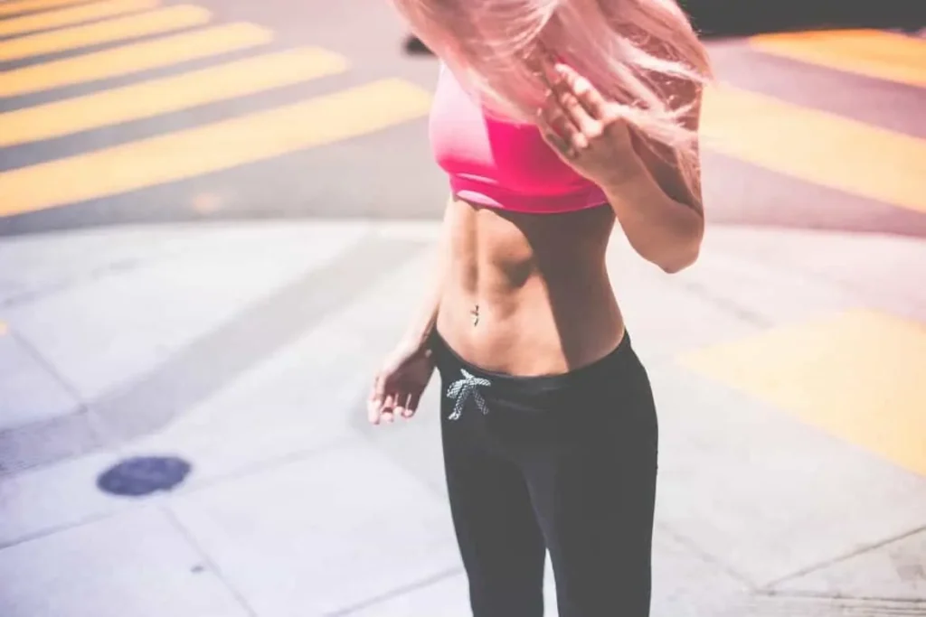 Woman with toned stomach after LA-EMS Body Sculpting Treatment Camberley 