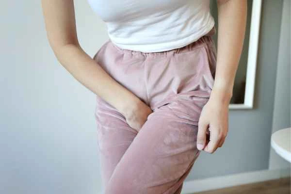 woman running for the toilet because of urinary incontinence Camberley